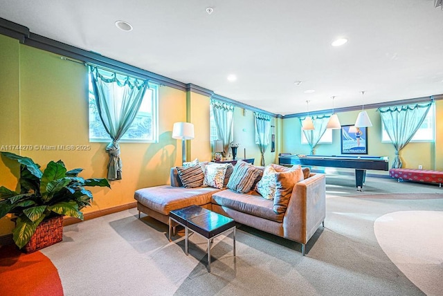 living room featuring billiards, light carpet, and a wealth of natural light