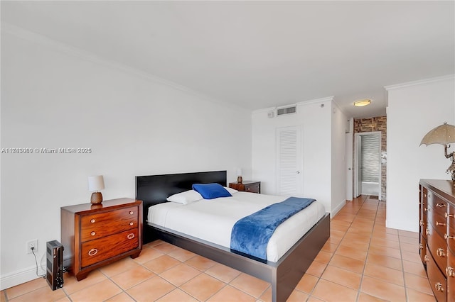 bedroom featuring light tile patterned floors and ornamental molding