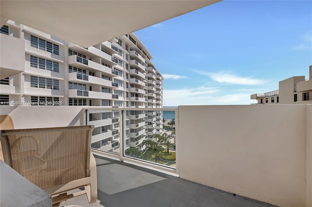 balcony featuring a water view