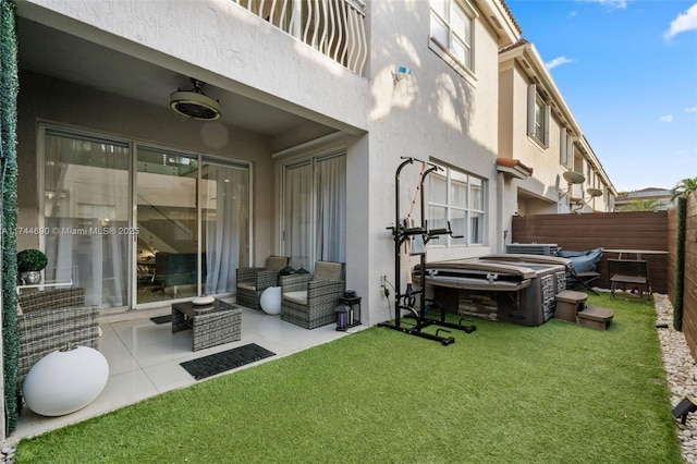 view of yard with ceiling fan and fence