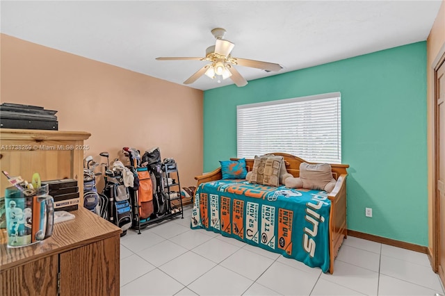 tiled bedroom with ceiling fan