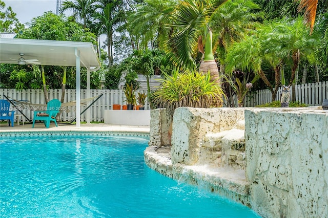 view of swimming pool with ceiling fan