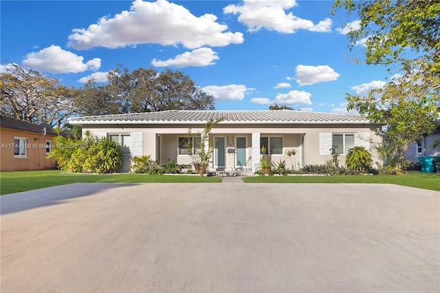 view of front of house featuring a front yard and covered porch