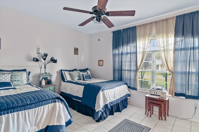 bedroom with light tile patterned floors and a ceiling fan