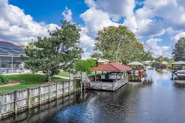 dock area with a water view and boat lift