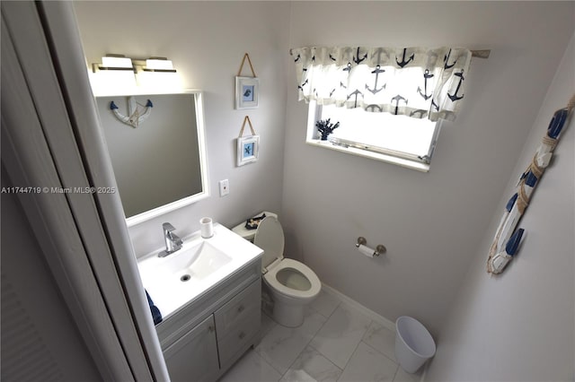 bathroom featuring vanity and toilet