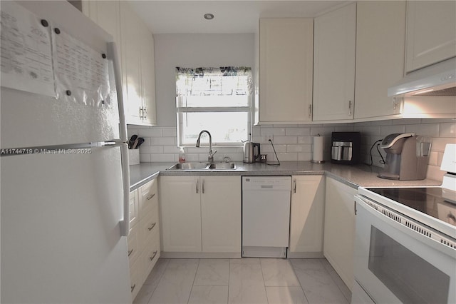 kitchen with sink, white appliances, and white cabinets