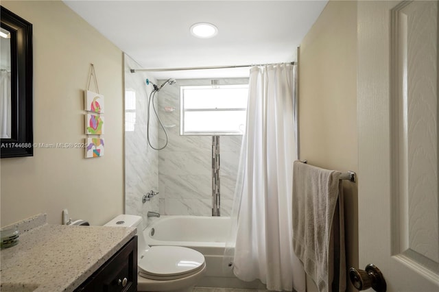 full bathroom with shower / bath combination with curtain, vanity, and toilet