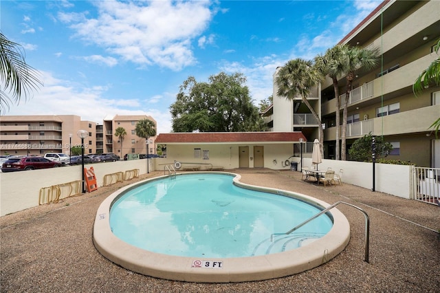 view of swimming pool with a patio area