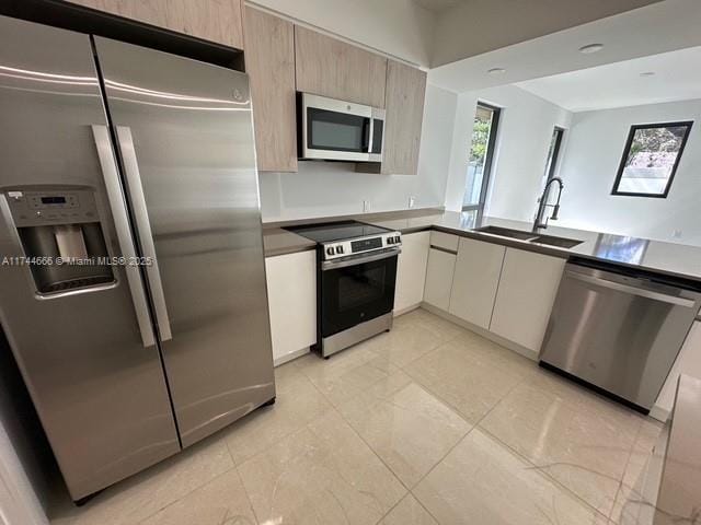 kitchen featuring appliances with stainless steel finishes and sink