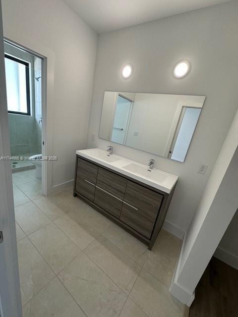 bathroom featuring tile patterned floors and vanity