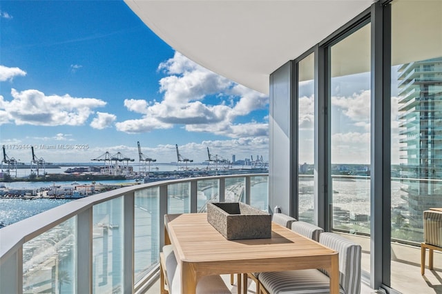 balcony featuring a water view