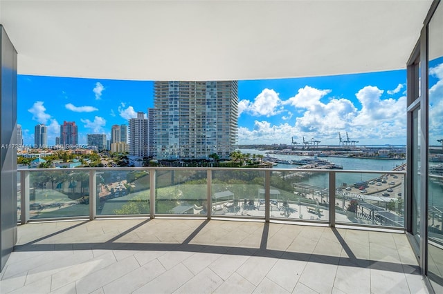 balcony featuring a water view