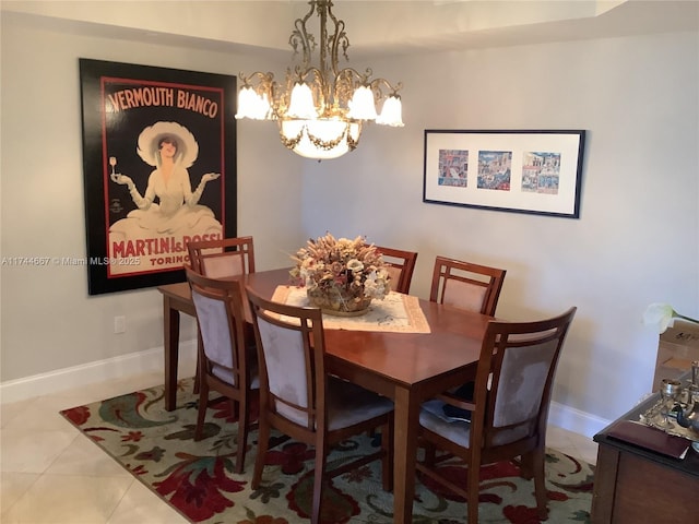 tiled dining area with an inviting chandelier