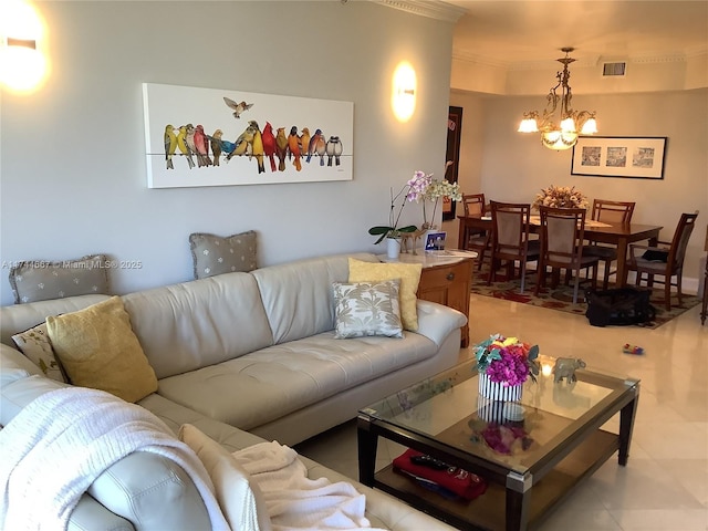 living room featuring crown molding and an inviting chandelier