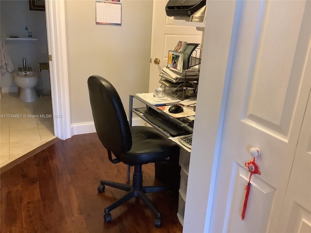 home office featuring dark wood-type flooring