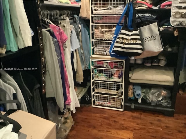 walk in closet featuring dark hardwood / wood-style flooring