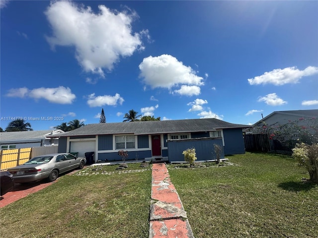 single story home with a garage and a front yard