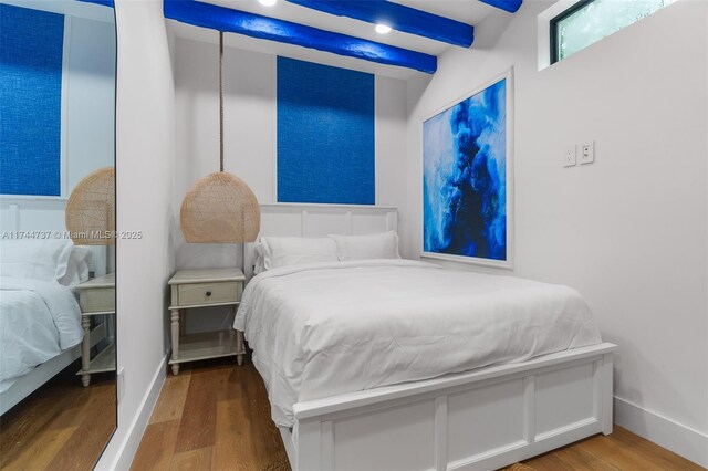 bedroom with wood-type flooring