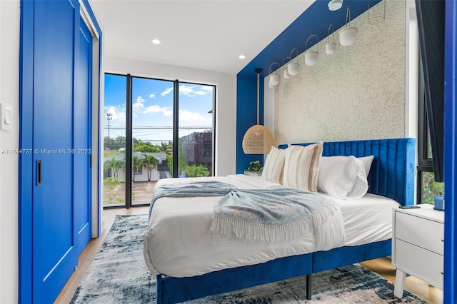 bedroom with light hardwood / wood-style floors