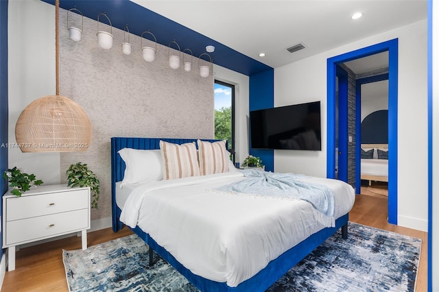 bedroom featuring hardwood / wood-style floors