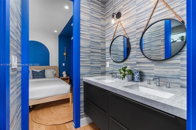 bathroom featuring vanity and decorative backsplash