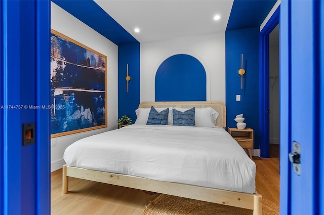 bedroom featuring hardwood / wood-style floors