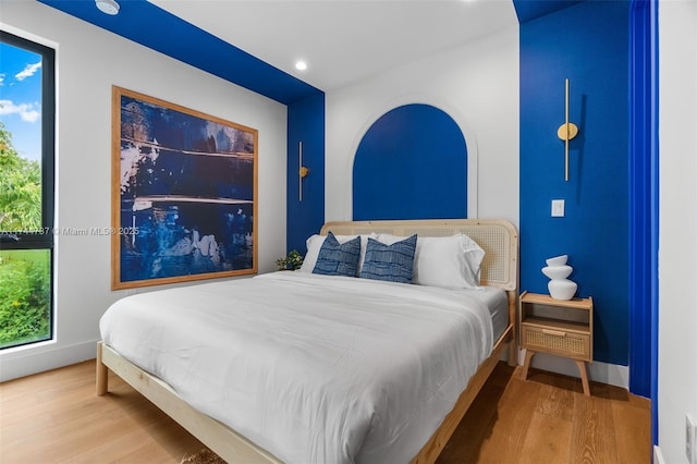 bedroom featuring hardwood / wood-style flooring