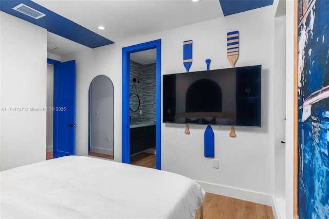 bedroom featuring hardwood / wood-style flooring