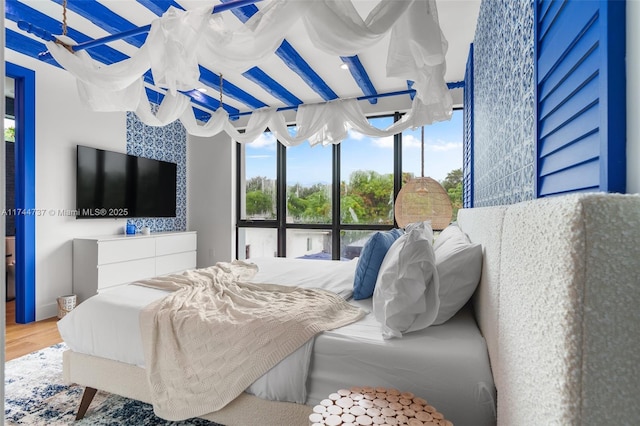 bedroom with wood-type flooring