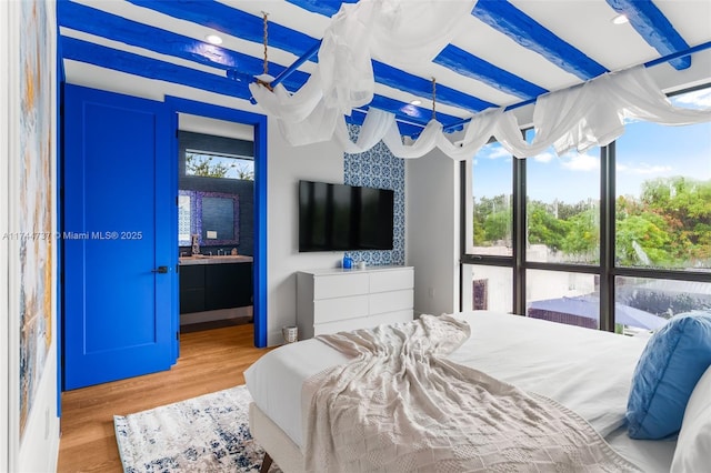 bedroom with light hardwood / wood-style flooring