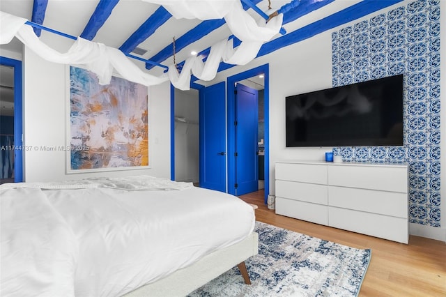 bedroom with light wood-type flooring