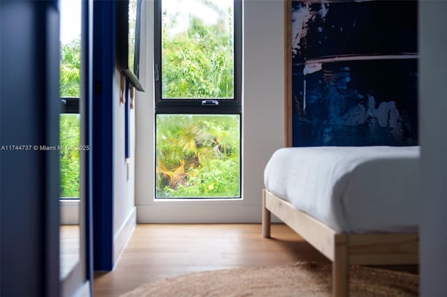 bedroom with light wood-type flooring