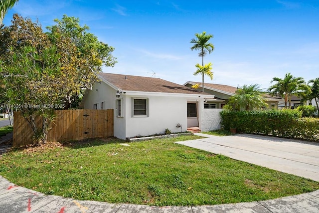 ranch-style house with a front lawn