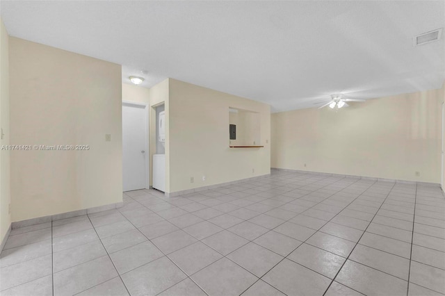 unfurnished room with light tile patterned floors, a textured ceiling, and ceiling fan