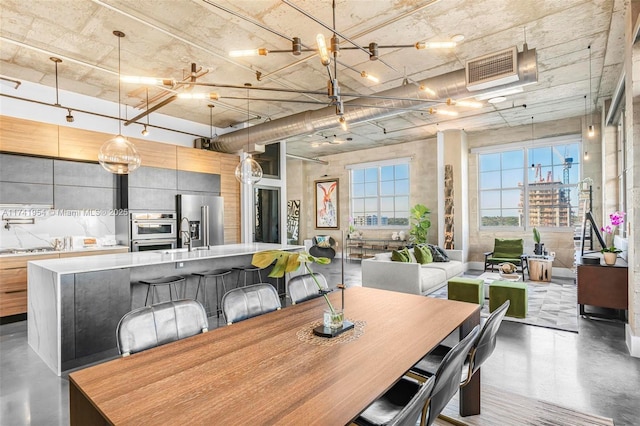 dining area with sink and concrete floors