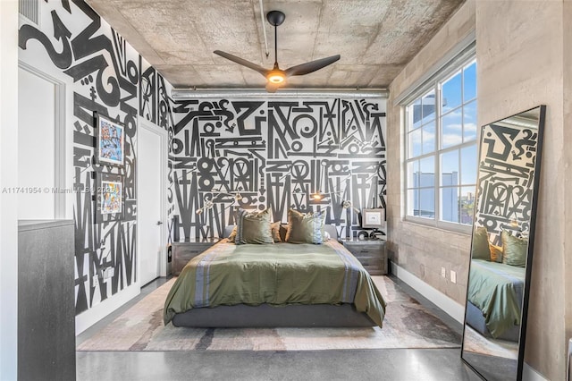 bedroom featuring concrete flooring