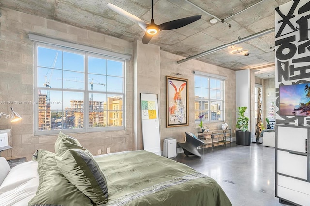 bedroom featuring concrete floors