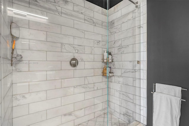 bathroom with tiled shower