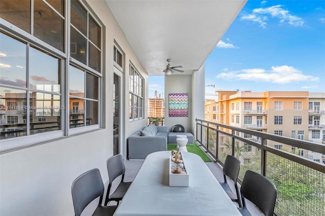 balcony with an outdoor hangout area and ceiling fan