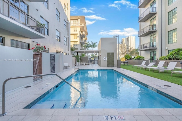 view of swimming pool with a patio area