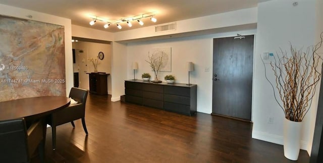 dining room with dark wood-type flooring