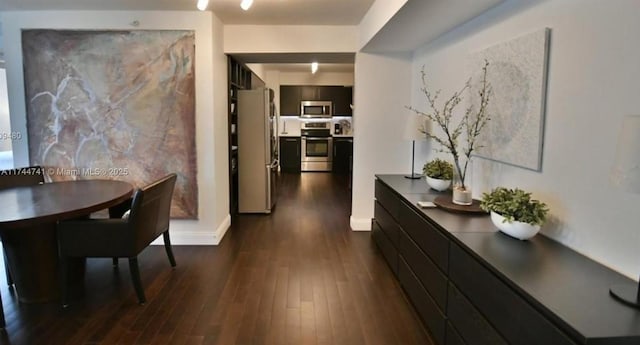 corridor featuring dark hardwood / wood-style floors