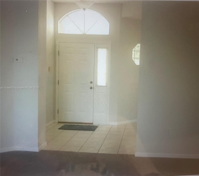 entryway featuring a healthy amount of sunlight and baseboards