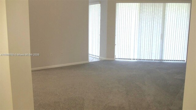 575 SE 29th Dr, Homestead, FL 33033 - unfurnished room with baseboards and carpet
