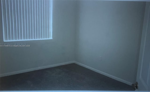 empty room with carpet flooring and baseboards