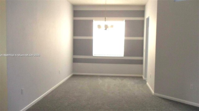 575 SE 29th Dr, Homestead, FL 33033 - spare room with baseboards and carpet flooring