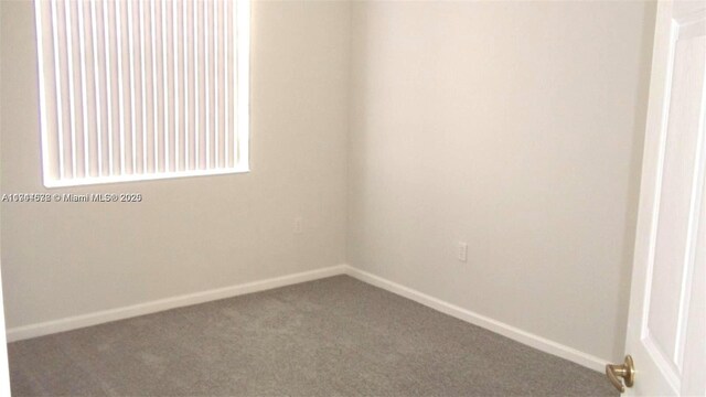 575 SE 29th Dr, Homestead, FL 33033 - carpeted spare room with baseboards