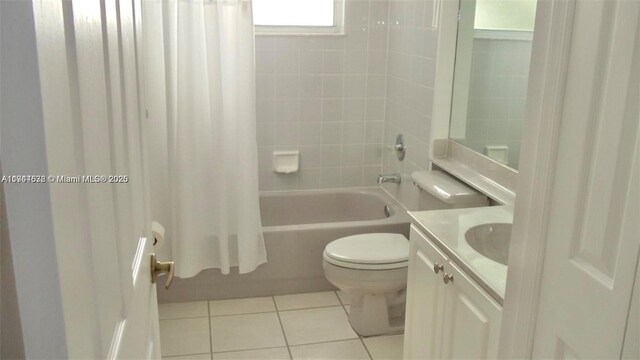 575 SE 29th Dr, Homestead, FL 33033 - full bath featuring tile patterned floors, vanity, toilet, and shower / bath combination with curtain