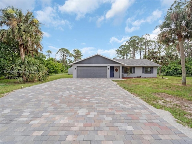 view of front of home with a garage and a front yard